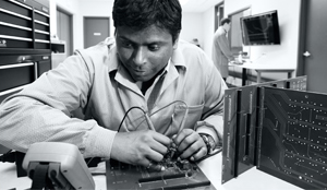 An Aviya engineer performing equipment testing.
